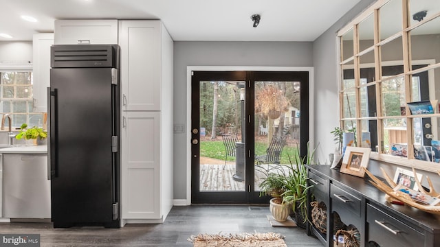 doorway to outside with dark hardwood / wood-style floors