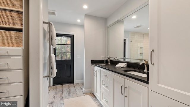 6082 Hounds Bay Cir, Salisbury, MD 21801 - bathroom with double vanity, wood finished floors, recessed lighting, baseboards, and a shower
