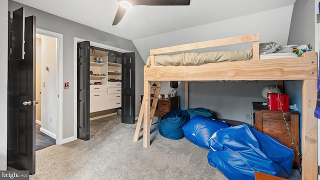 bedroom featuring carpet flooring, ceiling fan, and vaulted ceiling