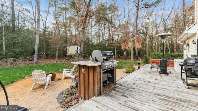 wooden terrace featuring grilling area