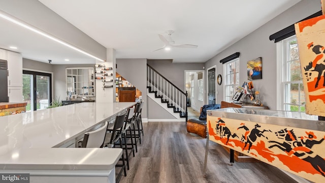 6082 Hounds Bay Cir, Salisbury, MD 21801 - kitchen with dark wood finished floors, white cabinets, a ceiling fan, baseboards, and light countertops
