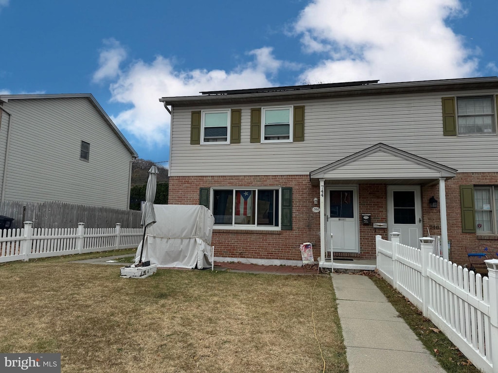 view of front of home with a front lawn