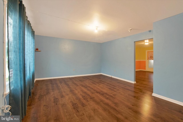 empty room featuring dark hardwood / wood-style floors