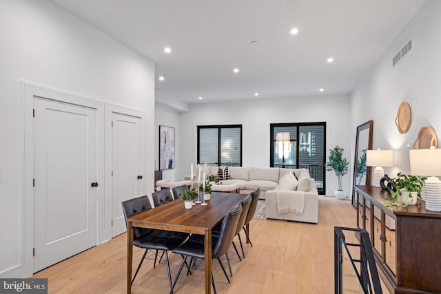 dining space with light wood-type flooring