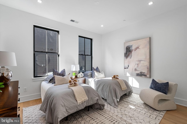 bedroom with light hardwood / wood-style flooring