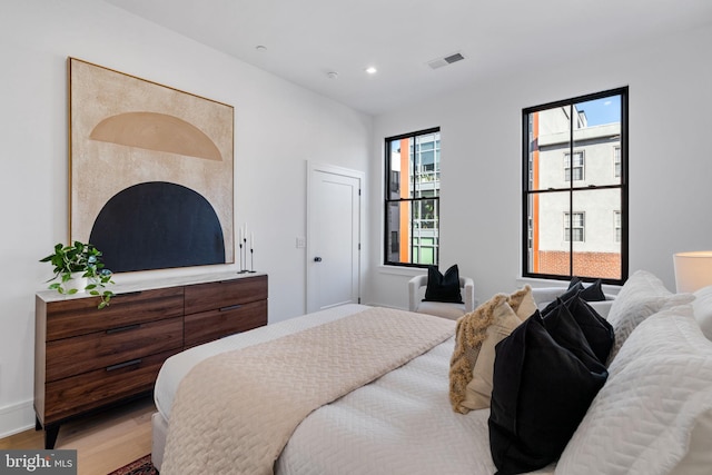 bedroom with light hardwood / wood-style flooring