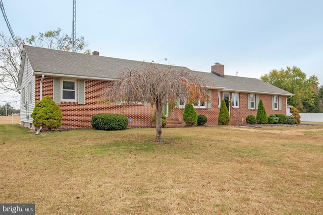 ranch-style home with a front yard