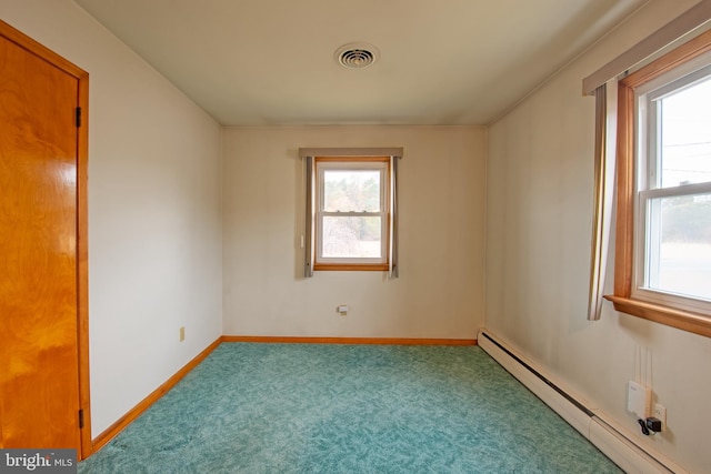 carpeted empty room featuring a baseboard radiator