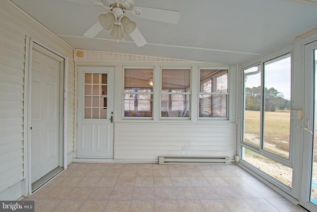 unfurnished sunroom featuring ceiling fan, lofted ceiling, and a baseboard radiator