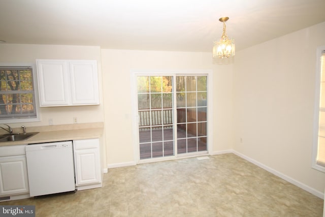 kitchen featuring white dishwasher, decorative light fixtures, white cabinets, and an inviting chandelier