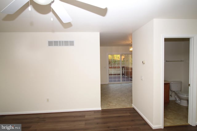 unfurnished room featuring dark hardwood / wood-style floors and ceiling fan