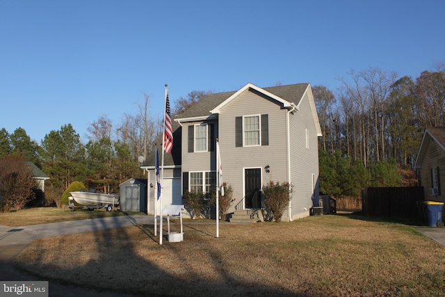 front facade with a front lawn and a storage unit