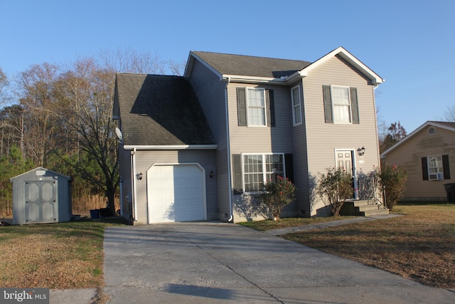 view of front of property with a front yard, a garage, and a storage shed