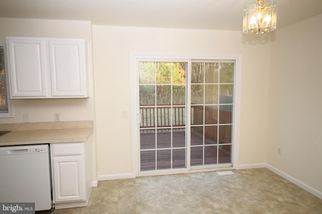 unfurnished dining area with light carpet and an inviting chandelier