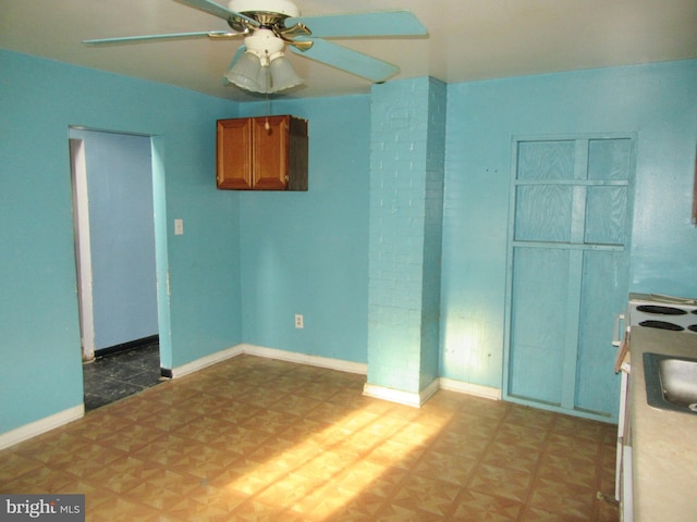 spare room with ceiling fan and sink