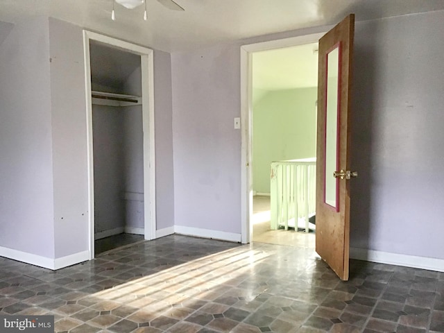 unfurnished bedroom with a closet and ceiling fan