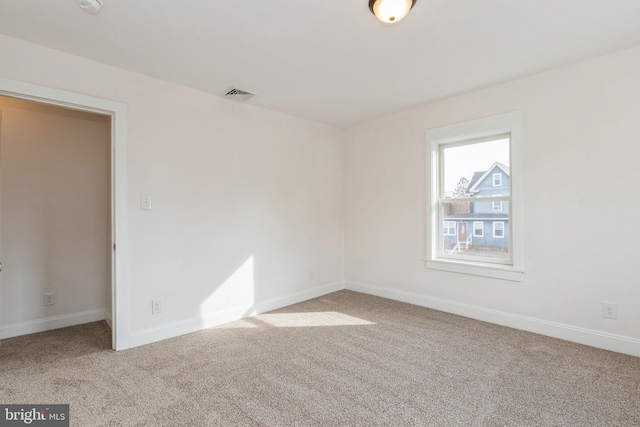 empty room featuring carpet flooring