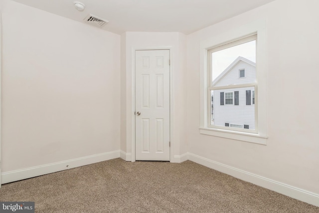 view of carpeted spare room