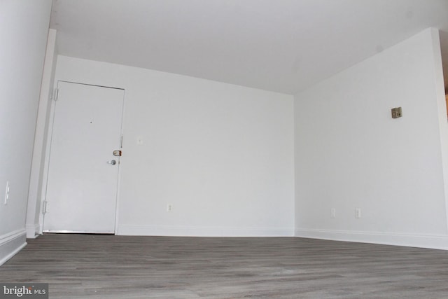 empty room featuring dark wood-type flooring