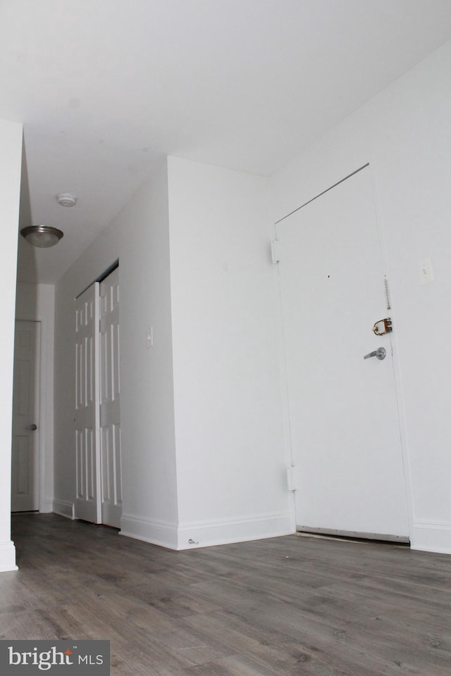 unfurnished room featuring dark hardwood / wood-style flooring