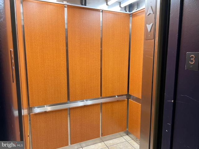 details with tile patterned floors and elevator