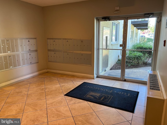 interior space with light tile patterned floors and mail boxes