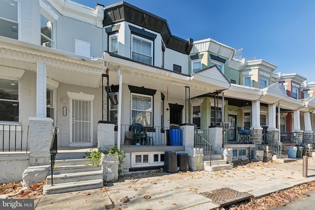 view of property with a porch