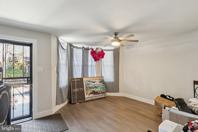 interior space with hardwood / wood-style flooring and ceiling fan