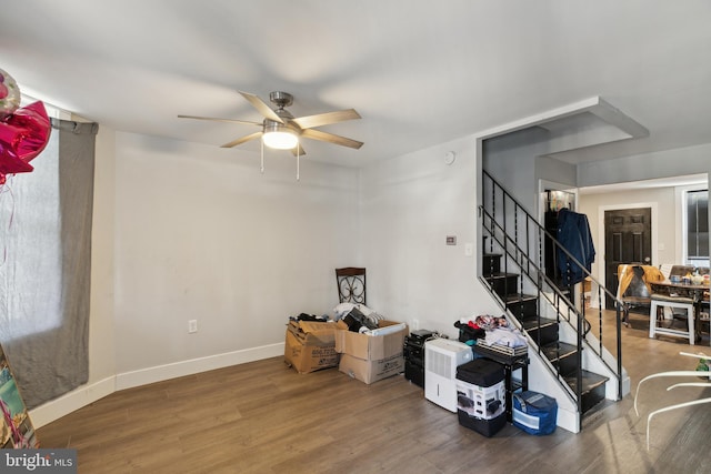 interior space with ceiling fan and hardwood / wood-style floors