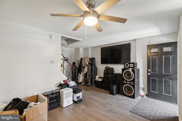 misc room with ceiling fan and light hardwood / wood-style flooring