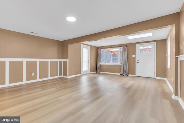 foyer with light hardwood / wood-style floors