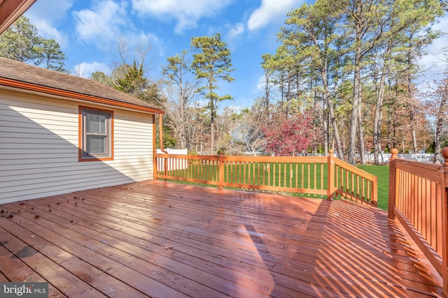 wooden deck with a yard