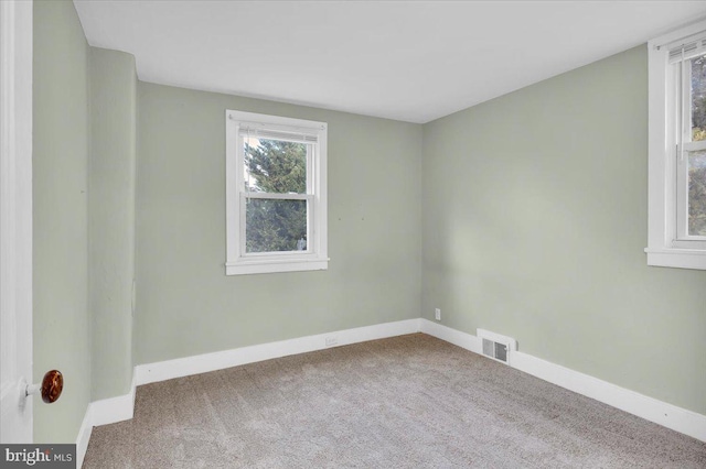 unfurnished room with carpet floors