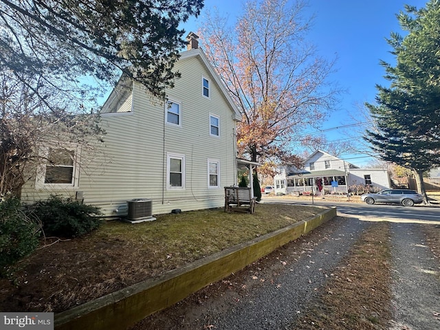 view of side of property with a lawn