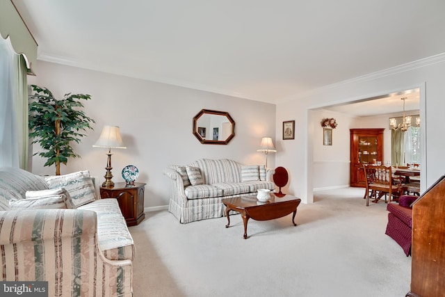 carpeted living room with ornamental molding and a chandelier