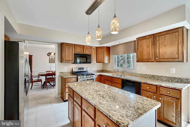 kitchen with sink, black appliances, light tile patterned floors, a center island, and hanging light fixtures