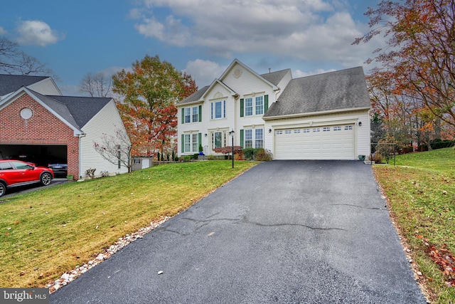 view of front facade with a front lawn and a garage