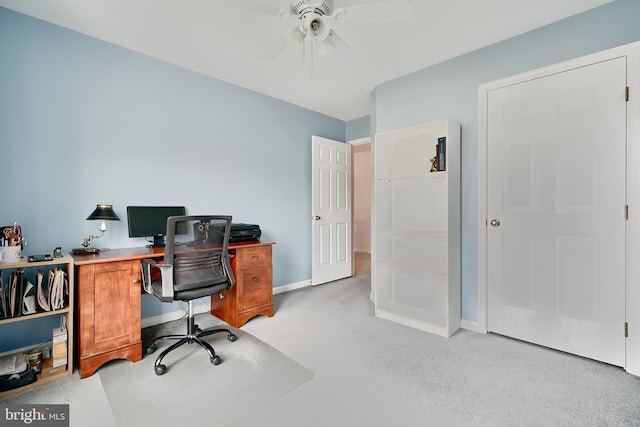 office with ceiling fan and light carpet