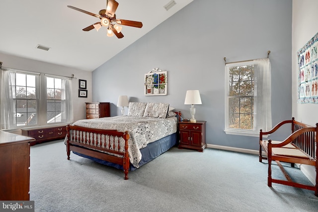 carpeted bedroom featuring high vaulted ceiling and ceiling fan