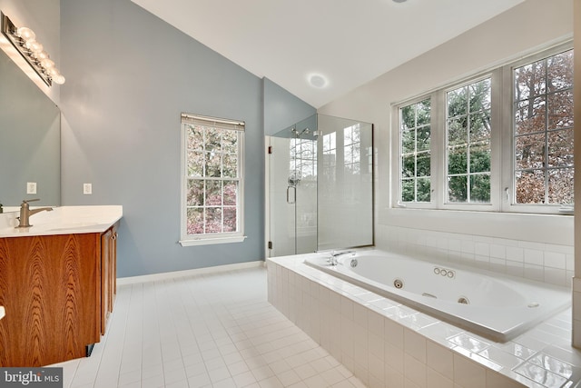 bathroom featuring tile patterned flooring, a healthy amount of sunlight, lofted ceiling, and separate shower and tub