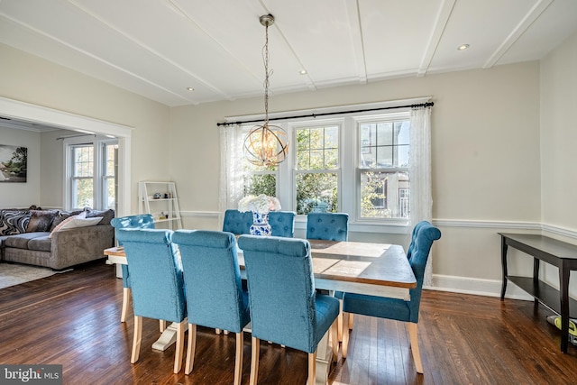 dining space with a chandelier and dark wood-type flooring