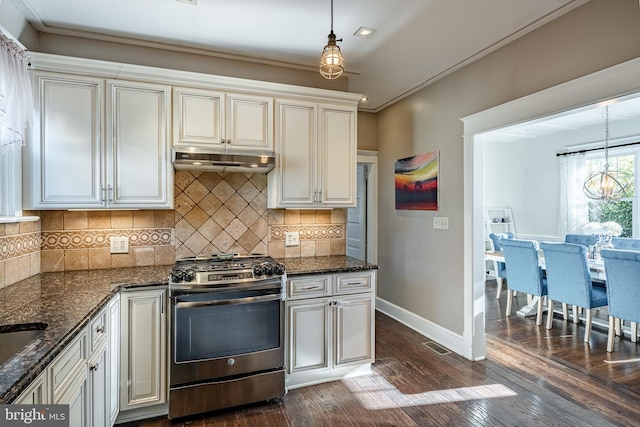 kitchen with pendant lighting, gas stove, dark hardwood / wood-style flooring, and ornamental molding