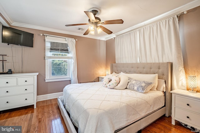 bedroom with ceiling fan, dark hardwood / wood-style floors, and ornamental molding