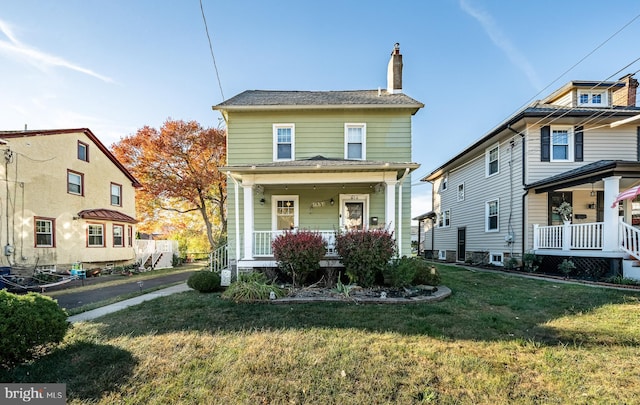 view of front of house featuring a front lawn and a porch