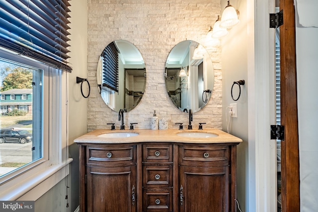 bathroom with tasteful backsplash and vanity