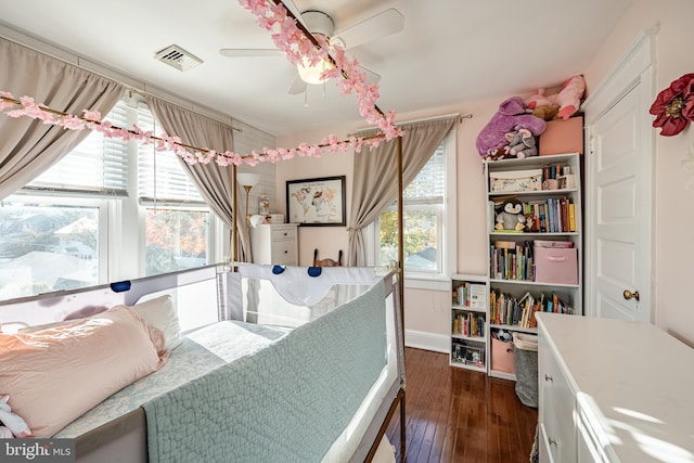 bedroom featuring ceiling fan and dark hardwood / wood-style flooring