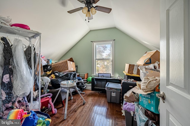 interior space featuring dark hardwood / wood-style floors, ceiling fan, and lofted ceiling