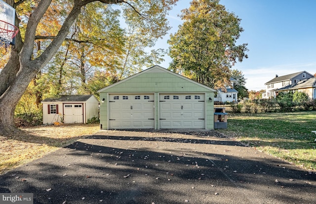 garage featuring a lawn