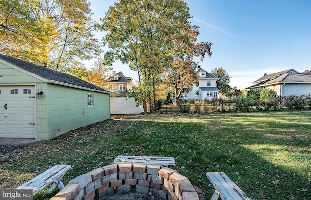 view of yard featuring an outbuilding and a garage