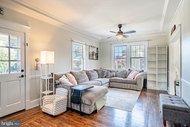 living room featuring a wealth of natural light, ceiling fan, and dark wood-type flooring